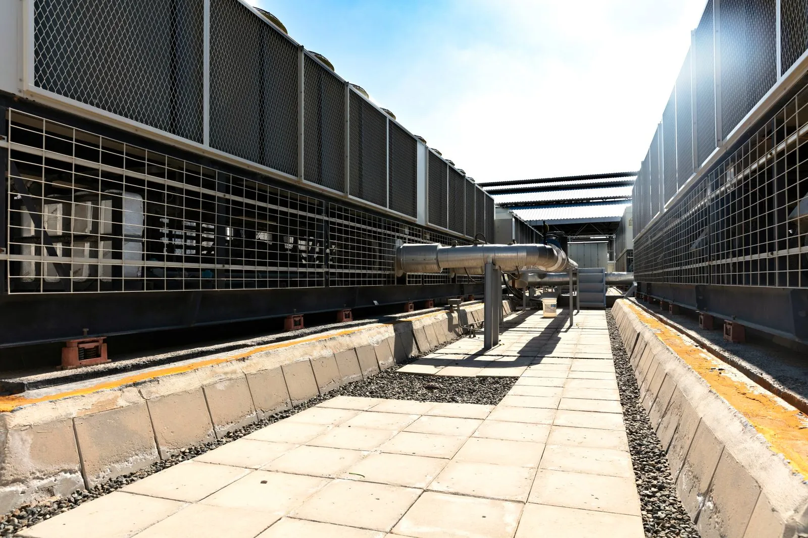 Commercial rooftop HVAC units on an industrial building
