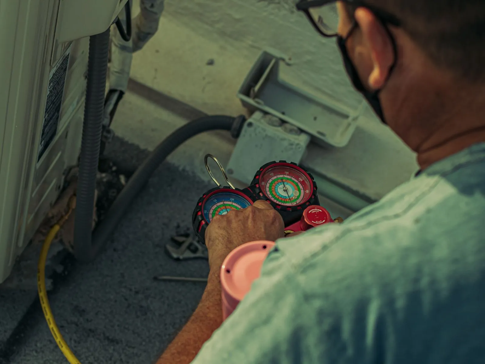 Technician installing a residential heat pump system